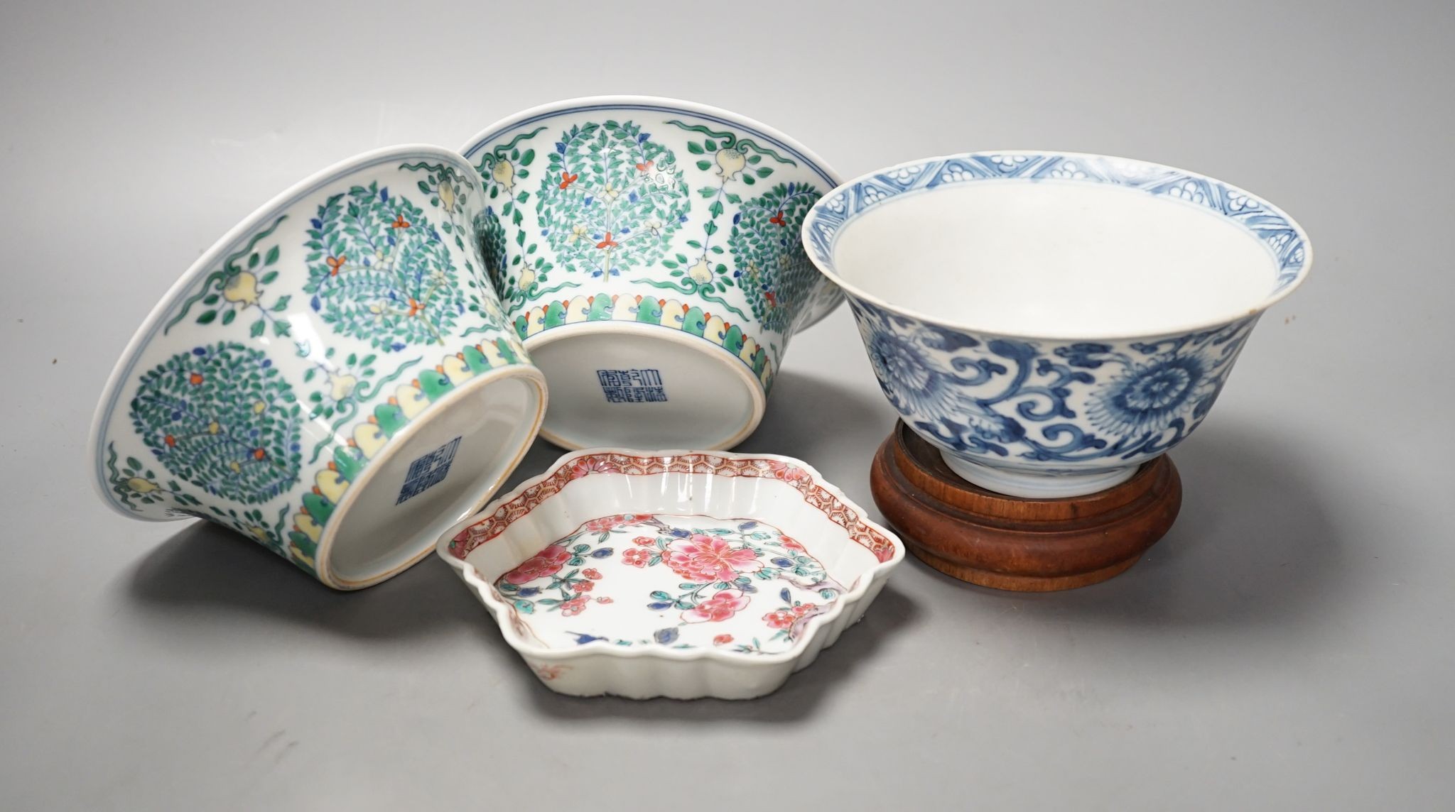 A Chinese blue and white bowl, Kangxi, 15cm. diam., a famille rose teapot stand, Yongzheng, and two doucai bowls